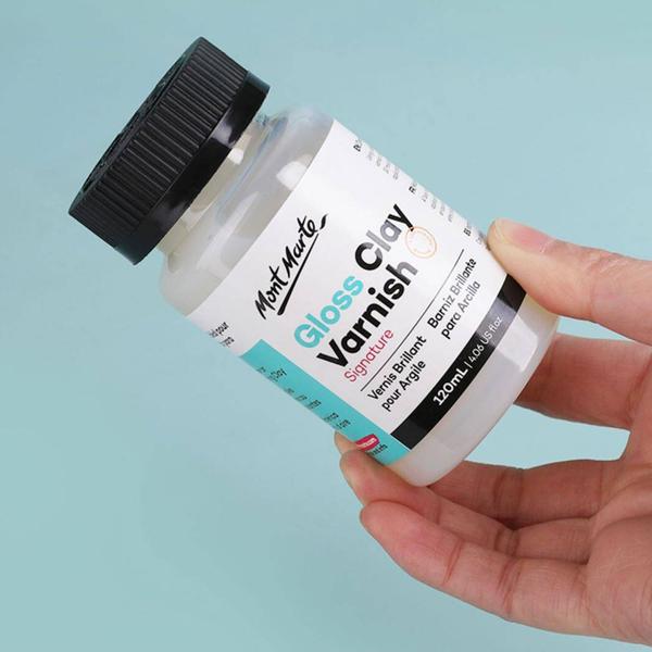 With our Gloss Clay Varnish, you may shield, reinforce, and seal your clay masterpieces. This varnish is perfect for polymer and air-hardening clay and dries to a clear, glossy finish. Additionally, this waterproof varnish dries hard, making it perfect for a variety of crafts, such as sealing your own plant pot or small jewelry pieces. Grab a bottle of our glossy clay varnish to quickly and easily finish and safeguard your labour of love.Get it now!PRODUCT DETAILS:Seals, protects, and strengthens claySuitable for polymer or air-hardening clayDries to a hard transparent, high gloss finishWater-proof formula great for DIY plant pots and moreEnhances paint colour underneath and surface appearanceDirections:Apply varnish in thin layers using a soft taklon brush, allowing approx. 30mins to dry between applicationsNote: may have a slight tacky touch on polymer projects due to plasticiser in clay
