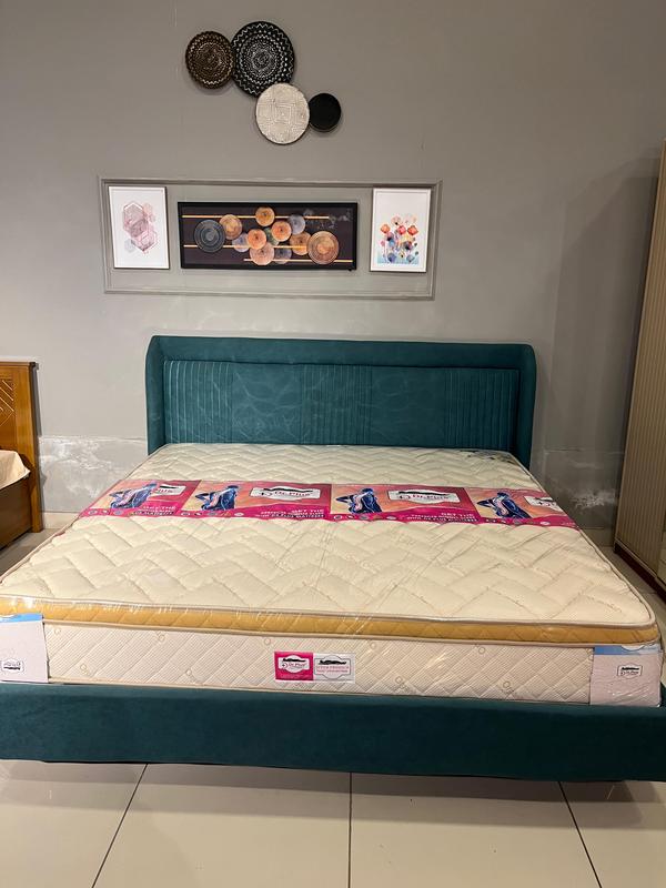 ### ZeeOn Box-Top Ultra Premium Pocketed Spring with Memory Foam Euro Top Mattress Overview#### Design and Construction1. **Core Materials** - **Pocketed Spring System**: - The ZeeOn Box-Top mattress features a sophisticated pocketed spring system, where each coil is individually wrapped to provide tailored support to different body areas. - This design significantly enhances motion isolation, allowing partners to move freely without disturbing each other. - The coils work independently, adapting to the sleeper’s movements and promoting proper spinal alignment.2. **Comfort Layer** - **Memory Foam Euro Top**: - The Euro top design incorporates a plush layer of high-quality memory foam that sits atop the pocketed springs, providing premium softness and comfort. - The memory foam contours to the body, offering pressure relief at critical points such as the shoulders and hips, ensuring a luxurious sleeping experience. - This layer also absorbs movement, minimizing disturbances from tossing and turning.3. **Fabric Used**: - **Organic Cotton / High-Quality Knitted Bamboo**: - The mattress cover is made from a combination of organic cotton and high-quality knitted bamboo fabric, offering a soft, breathable, and eco-friendly surface. - Both materials are naturally moisture-wicking and hypoallergenic, making them ideal for sensitive skin and promoting a restful, irritation-free sleep. - The bamboo fabric enhances the mattress’s cooling properties, ensuring a comfortable temperature throughout the night.#### Benefits- **Luxurious Comfort**: - The combination of the pocketed spring system and memory foam Euro top provides a perfect blend of support and plush comfort, catering to diverse sleep preferences.- **Eco-Friendly Materials**: - The use of organic cotton and bamboo fabric emphasizes sustainability, making this mattress a responsible choice for environmentally conscious consumers.- **Durability and Warranty**: - Constructed with premium materials, the ZeeOn Box-Top mattress is designed for longevity and performance, supported by a 10-year warranty, giving peace of mind for customers regarding their investment.- **Temperature Regulation**: - The breathable materials used in the mattress cover help regulate temperature, making it a great choice for those who tend to sleep hot.#### Recommendations- **Ideal For**: - Individuals seeking a luxurious, ultra-comfortable mattress that provides excellent support and plushness. - Eco-conscious consumers looking for a mattress made from organic and sustainable materials. - Couples who require good motion isolation along with a soft, comfortable surface.