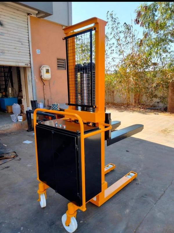 Fully Battery-Operated Stacker Manufacturers in AhmedabadWe are also supply in Andhra Pradesh, Arunachal Pradesh, Assam, Bihar, Chhattisgarh, Goa, Gujarat, Haryana, Himachal Pradesh, Jharkhand, Karnataka, Kerala, Madhya Pradesh, Maharashtra, Manipur, Meghalaya, Mizoram, Nagaland, Odisha, Punjab, Rajasthan, Sikkim, Tamil Nadu, Telangana, Tripura, Uttar Pradesh, Uttarakhand, and West Bengal1. General SpecificationsType: Electric/Battery Operated StackerOperation Mode: Walkie / Ride-on / Stand-onUsage: Lifting & Stacking Pallets, Material Handling2. Lifting CapacityLoad Capacity: 1 Ton to 2.5 Tons (1000 kg - 2500 kg)Lifting Height: 1600 mm to 5500 mm (Custom options available)Fork Length: 1000 mm to 1200 mmFork Width: 550 mm to 700 mmLoad Center: 500 mm3. Battery & Power SystemBattery Type: Lead Acid / Lithium-ionBattery Voltage: 24V / 48VBattery Capacity: 100Ah - 300AhCharging Time: 6 - 8 HoursCharger Type: Automatic, High-Frequency Charger4. Performance & SpeedLifting Speed: 80 mm/s - 120 mm/sLowering Speed: 90 mm/s - 130 mm/sTravel Speed (Laden/Unladen): 4 - 6 km/hGradeability (Laden/Unladen): 5° - 8°5. Safety FeaturesEmergency Stop ButtonAnti-Roll Back Braking SystemSafety Buzzer & HornOverload Protection SystemElectromagnetic Brakes6. Structural FeaturesMast Type: Single / Double / Triple MastMaterial: Heavy-Duty Steel FrameDrive Type: AC / DC Motor7. Additional FeaturesErgonomic Handle with Multifunction ControlLED Display for Battery Status & Fault IndicatorsAdjustable Forks for Versatile Load HandlingOptional Attachments (Side Shift, Clamp, etc.)