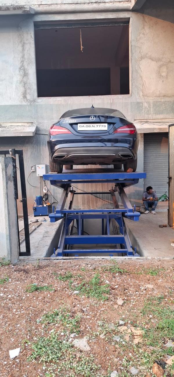 Hydraulic car lift Manufacturers in Rajasthan/AhmedabadWe are also supply in Andhra Pradesh, Arunachal Pradesh, Assam, Bihar, Chhattisgarh, Goa, Gujarat, Haryana, Himachal Pradesh, Jharkhand, Karnataka, Kerala, Madhya Pradesh, Maharashtra, Manipur, Meghalaya, Mizoram, Nagaland, Odisha, Punjab, Rajasthan, Sikkim, Tamil Nadu, Telangana, Tripura, Uttar Pradesh, Uttarakhand, and West BengalA Hydraulic Car Lift is a mechanical device used to elevate vehicles for repairs, maintenance, and storage, operating through a hydraulic system for smooth and controlled lifting. These lifts come in various types, including two-post, four-post, scissor, and in-ground models, catering to different automotive service needs. They provide a stable and secure platform for mechanics to work underneath vehicles, enhancing efficiency and safety in workshops and garages. Hydraulic car lifts are designed with robust steel frames and safety locking mechanisms to ensure reliability and prevent accidents. Their ease of use, durability, and high lifting capacity make them essential in auto repair shops, parking facilities, and car showrooms.