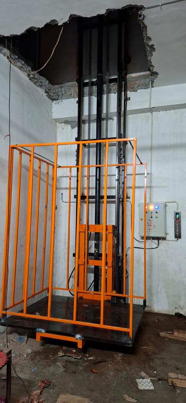 Hydraulic Goods Lift Manufacturers in Rajasthan/AhmedabadWe are also supply in Andhra Pradesh, Arunachal Pradesh, Assam, Bihar, Chhattisgarh, Goa, Gujarat, Haryana, Himachal Pradesh, Jharkhand, Karnataka, Kerala, Madhya Pradesh, Maharashtra, Manipur, Meghalaya, Mizoram, Nagaland, Odisha, Punjab, Rajasthan, Sikkim, Tamil Nadu, Telangana, Tripura, Uttar Pradesh, Uttarakhand, and West BengalA hydraulic goods lift is an essential material handling solution designed for lifting heavy loads between different levels in warehouses, factories, and commercial buildings. It operates using hydraulic mechanisms, ensuring smooth and efficient vertical transportation of goods. These lifts are widely used in industries where the movement of heavy materials is a frequent requirement.The working principle of a hydraulic goods lift is based on Pascal’s Law, which states that pressure applied to a confined fluid is transmitted equally in all directions. A hydraulic cylinder, powered by a pump, raises and lowers the platform smoothly. This system ensures high load-bearing capacity and reliable performance.One of the key advantages of hydraulic goods lifts is their ability to handle heavy loads with minimal power consumption. Compared to traditional mechanical lifts, they offer superior efficiency and durability. Their simple design also reduces maintenance costs, making them a cost-effective choice for businesses.Hydraulic lifts are available in various configurations, such as single mast, double mast, and scissor lifts, to suit different industrial needs. The lifting capacity ranges from a few hundred kilograms to several tons, depending on the model and design. Customization options allow businesses to optimize the lift according to their specific requirements.