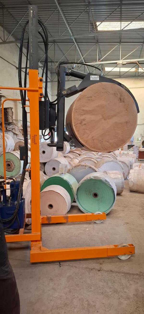Hydraulic Paper Roll Stacker Manufacturers in Rajasthan/AhmedabadWe are also supply in Andhra Pradesh, Arunachal Pradesh, Assam, Bihar, Chhattisgarh, Goa, Gujarat, Haryana, Himachal Pradesh, Jharkhand, Karnataka, Kerala, Madhya Pradesh, Maharashtra, Manipur, Meghalaya, Mizoram, Nagaland, Odisha, Punjab, Rajasthan, Sikkim, Tamil Nadu, Telangana, Tripura, Uttar Pradesh, Uttarakhand, and West BengalA hydraulic paper roll stacker is a specialized material handling equipment designed to lift, transport, and stack heavy paper rolls efficiently. It is widely used in industries such as printing, packaging, and paper manufacturing, where handling large rolls is a routine task.The stacker operates using a hydraulic lifting mechanism, which ensures smooth and controlled movement of paper rolls. A hydraulic pump powers the lifting action, enabling operators to position rolls with precision. This makes it an ideal solution for reducing manual labor and improving workplace safety.One of the main advantages of a hydraulic paper roll stacker is its ability to handle heavy loads with minimal effort. It significantly reduces the risk of workplace injuries caused by manual lifting. Additionally, its user-friendly design allows operators to handle rolls with ease, increasing productivity.These stackers come in various models to accommodate different roll sizes and weights. Some models feature adjustable clamps or cradle attachments to secure the rolls firmly during transportation. Customization options are also available to meet specific industry requirements.