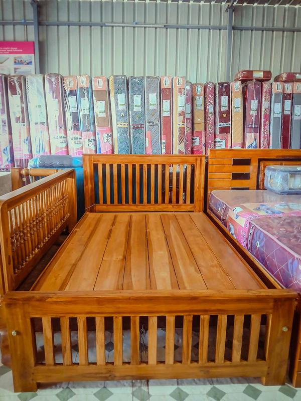 TODAY INFORMATION = Teak doesn't crack, wrap or turn black when in contact with metalsA full teak wood medium-sized cot typically refers to a bed frame made entirely from teak wood, designed to accommodate a medium-sized mattress. Material: Made entirely from teak wood, known for its durability, water resistance, and natural oils that protect it from pests and decay.Design: Teak wood cots often feature a classic, elegant design with sturdy construction. They may include carved details, slatted bases for ventilation, or minimalist modern styles.Durability: Teak wood is highly durable and can last for decades with proper care, making it a long-term investment.Maintenance: Teak requires minimal maintenance. Regular dusting and occasional polishing with teak oil can help maintain its natural luster.Strength: Teak is one of the strongest hardwoods, ensuring the cot is sturdy and long-lasting.Aesthetic Appeal: Teak has a rich, golden-brown color and a smooth grain, adding a touch of elegance to any bedroom.Resistance: Naturally resistant to moisture, termites, and fungi, making it ideal for furniture.Mattress Compatibility: Ensure the cot frame is compatible with the thickness and type of mattress you plan to use.Maintenance Tips:Clean the cot regularly with a soft cloth to remove dust.Avoid using harsh chemicals or abrasive cleaners.Apply teak oil or sealant periodically to maintain its natural color and prevent drying or cracking.