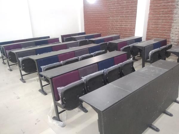 Tip-up institutional chairs are space-saving, durable seating solutions ideal for auditoriums, lecture halls, and conference rooms. Designed with a foldable seat mechanism, they provide easy access and maximize space efficiency. These chairs feature ergonomic designs for enhanced comfort, sturdy metal or wooden frames for durability, and optional armrests and upholstery for added convenience. Perfect for educational institutions, corporate settings, and event spaces, they offer a blend of functionality and aesthetics.