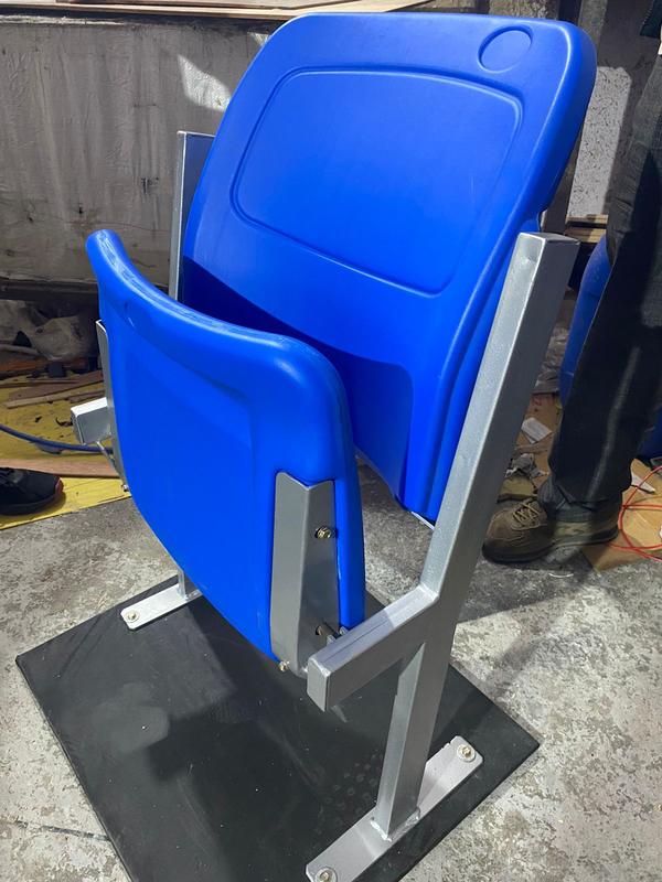 A Tip-up Stadium Chair is a space-saving seating solution ideal for stadiums, arenas, and auditoriums. Designed with a spring-loaded mechanism, the seat automatically folds up when not in use, allowing for easy movement and maintenance. Made from durable materials like molded plastic or cushioned metal frames, these chairs offer comfort, longevity, and efficient space utilization. They are available in various colors and styles, making them perfect for enhancing venue aesthetics.