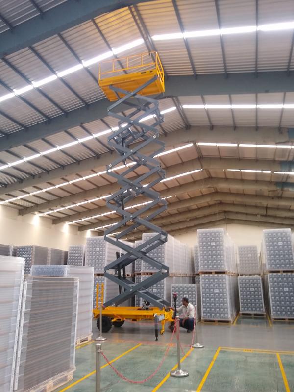 Hydraulic Movable Scissor Lift Manufacturers in Rajasthan/AhmedabadWe are also supply in Andhra Pradesh, Arunachal Pradesh, Assam, Bihar, Chhattisgarh, Goa, Gujarat, Haryana, Himachal Pradesh, Jharkhand, Karnataka, Kerala, Madhya Pradesh, Maharashtra, Manipur, Meghalaya, Mizoram, Nagaland, Odisha, Punjab, Rajasthan, Sikkim, Tamil Nadu, Telangana, Tripura, Uttar Pradesh, Uttarakhand, and West BengalA hydraulic movable scissor lift is a versatile lifting platform designed to raise personnel, equipment, or materials to different heights safely and efficiently. It operates using a hydraulic system that powers the scissor-like mechanism, allowing for smooth vertical movement. These lifts are commonly used in warehouses, construction sites, maintenance facilities, and assembly lines.One of the key advantages of a hydraulic movable scissor lift is its effortless lifting capability. The hydraulic mechanism provides stable and controlled elevation, reducing the need for manual labor. Operators can adjust the height with ease, improving workplace efficiency and reducing fatigue.The mobility of these lifts makes them highly practical. Equipped with heavy-duty wheels or casters, they can be easily transported across different work areas. Some models feature self-propelled movement, allowing operators to drive the lift to the desired location without additional effort.Hydraulic movable scissor lifts offer excellent load-bearing capacity, with models capable of lifting anywhere from a few hundred kilograms to several tons. This makes them suitable for handling heavy equipment, tools, and personnel for tasks like painting, repairs, and installations at elevated heights.