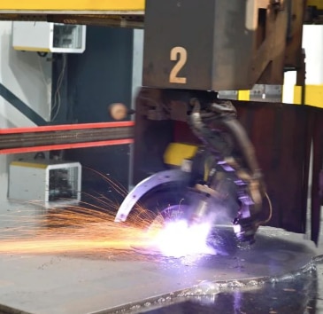 Stainless steel plasma cutting is another widely used method for cutting through stainless steel and other metals. This process uses a high-temperature plasma arc to melt and cut the material with precision. It is effective for cutting through thicker materials compared to laser cutting and is often used in heavy industries.### **How Stainless Steel Plasma Cutting Works:**1. **Plasma Arc Generation:** A plasma cutter generates an electrical arc that passes through a nozzle. This arc ionizes the air, creating plasma (a superheated, electrically conductive gas).2. **Plasma Stream:** The plasma is forced through a small nozzle, where it reaches temperatures up to 30,000°F (16,649°C), hot enough to melt the stainless steel.3. **Cutting:** The plasma stream moves along the surface of the material, melting and blowing away the molten metal, creating a cut in the stainless steel.4. **Control:** CNC (Computer Numerical Control) or manual operation controls the movement of the plasma torch along the cutting path. CNC plasma cutters allow for complex, automated designs.### **Advantages of Stainless Steel Plasma Cutting:**1. **Speed:** Plasma cutting is fast, making it ideal for cutting large quantities of stainless steel or other metals. It's much quicker than processes like oxy-fuel cutting.2. **Cost-Effective:** Plasma cutting is generally more affordable than other high-precision cutting methods (such as laser cutting) for thicker materials.3. **Versatility:** It can cut a variety of metals including stainless steel, carbon steel, aluminum, and more.4. **Cutting Thickness:** Plasma cutters are very effective for cutting medium to thick stainless steel (up to 2-3 inches or more), making them a popular choice for industrial applications.5. **Edge Quality:** Plasma cutting typically provides clean cuts, though the edges may have some roughness or a slight bevel (depending on the power of the plasma cutter and settings).6. **Minimal Material Distortion:** While it does create some heat, plasma cutting minimizes warping or distortion of the material when done properly.### **Limitations of Plasma Cutting:**- **Precision:** While plasma cutting is great for thicker materials, it may not be as precise as laser cutting, particularly when working with thinner stainless steel or requiring very intricate designs.- **Edge Finish:** Plasma cutting may leave slightly rough edges compared to the smooth finish from a laser cutter. However, it can often be smoothed with additional processing.- **Heat Affected Zone (HAZ):** The high temperatures from the plasma arc can affect the material around the cut, causing slight changes in its properties. This is generally a minor concern, but for certain applications, this may need to be considered.### **Applications of Stainless Steel Plasma Cutting:**- **Metal Fabrication:** Used to create parts and components for machinery, structures, and products in industries like construction, automotive, and aerospace.- **Signage and Art:** Plasma cutting is used for creating industrial and artistic designs in stainless steel sheets.- **Heavy Industries:** It’s often used to cut thick stainless steel plates for heavy equipment, storage tanks, and other industrial structures.- **Custom and Precision Work:** While it’s not as precise as laser cutting, plasma cutting can still handle a wide range of custom work that requires medium-level precision.### **Comparing Plasma Cutting to Other Methods:**- **Laser Cutting vs Plasma Cutting:** While laser cutting provides higher precision and cleaner edges, plasma cutting is faster, especially for thicker stainless steel materials. Plasma cutting is more cost-effective for thicker cuts, whereas laser cutting excels in thin and intricate designs.- **Oxy-fuel Cutting vs Plasma Cutting:** Oxy-fuel cutting is typically used for thicker metals, but it’s slower and less precise compared to plasma cutting. Plasma cutting is also more efficient for stainless steel than oxy-fuel.Would you like more details on a particular aspect of stainless steel plasma cutting or need information about a specific application?