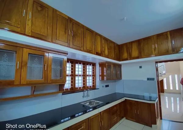 Today Information = Teak is a close-grained type of hardwood. It is widely considered to be the 'king of woods'A Leading Teak Wood Interiors We Provide Affordable Cost And No Compromise In Quality In Works Original NIlambur Teak Wood Only Used For All. Teak wood is a popular choice for kitchen interiors due to its durability, natural resistance to moisture, and elegant appearanceBenefits of Teak Wood for Kitchen InteriorsDurability: Teak is highly durable and can withstand heavy use, making it ideal for kitchens.Moisture Resistance: Its natural oils make it resistant to water, humidity, and pests, which is perfect for a kitchen environment.Aesthetic Appeal: Teak has a rich, warm color and beautiful grain patterns that add a luxurious feel to the kitchen.Low Maintenance: Teak requires minimal maintenance and ages gracefully, developing a silvery patina over time.FlooringTeak wood flooring is sturdy and resistant to wear and tear. It’s also comfortable underfoot and easy to clean.d) ShelvingOpen or closed teak wood shelves provide both functionality and aesthetic appeal.e) BacksplashA teak wood backsplash can create a unique focal point in the kitchen. Pair it with neutral tiles or stone for contrast.f) Island or Breakfast BarA teak wood kitchen island or breakfast bar adds a luxurious touch and serves as a functional workspace.g) Ceiling Beams or PanelingFor a cohesive look, consider teak wood ceiling beams or paneling.Design ConsiderationsColor Palette: Teak wood has a warm, golden-brown hue. Pair it with neutral tones like white, beige, or gray for a balanced look.Hardware: Choose complementary hardware (handles, knobs) in materials like brass, stainless steel, or matte black.Lighting: Use warm lighting to enhance the natural beauty of teak wood.Ventilation: Ensure proper ventilation to maintain the wood’s quality and prevent moisture buildup.SustainabilityTeak wood is often sourced from plantations. Ensure your supplier provides FSC (Forest Stewardship Council) certified teak to support sustainable practices.