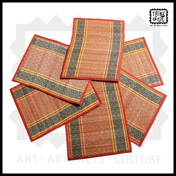 India’s rich cultural heritage is adorned with numerous traditional crafts that have withstood the test of time. One such age-old art form is Madurkathi, a weaving technique that finds its roots in Bengal. With mentions in ancient literature like the Mahabharata and the Vedas, Madurkathi holds deep historical significance. The heart of Madurkathi craft lies in the intricate weaving process. It begins with the loom setting, where traditional “char dhap” looms are used. Soft reeds and cotton are arranged on a bamboo frame loom as weft and warp, respectively. Table mats along with middle runner for every occasion. Gives your dining, an ethnic feel due the natural crafting technique. The table mats are made from madur grass by artisans in Medinipur district. The madur grass absorbs any extra water that falls on it, making it ideal for use as table mats. Madurkathi craft stands as a testament to India’s rich artistic and cultural heritage. With its ancient origins, sustainable practices, and versatile products, Madurkathi continues to enchant people worldwide. Gifting / Table & Dining/ Bamboo cane & grass