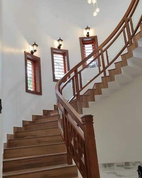 Planning and Design ConsiderationsPurpose: Determine the primary use of the staircase (e.g., main staircase, outdoor staircase, decorative feature).Space: Measure the available space to determine the staircase's dimensions (height, width, and length).Style: Choose a design style (e.g., modern, traditional, minimalist, spiral, straight, L-shaped, U-shaped).Building Codes: Ensure the design complies with local building codes and safety standards (e.g., tread depth, riser height, handrail height).Material SelectionTeak Wood: Known for its durability, water resistance, and natural beauty, teak is ideal for both indoor and outdoor staircases.Grade of Teak: Choose between premium-grade teak (fewer knots, uniform color) or standard-grade teak (more knots, varied color).Finish: Decide on a finish (e.g., natural oil, varnish, or polished) to enhance the wood's appearance and protect it. Structural ComponentsTreads: The horizontal steps where you step. Teak wood treads are durable and slip-resistant.Risers: The vertical parts between treads. These can be made of teak or a complementary material.Stringers: The inclined boards that support the treads and risers. Teak stringers add strength and elegance.Handrails: Teak handrails provide safety and a polished look.Balusters/Spindles: Vertical supports between the handrail and treads. These can be teak or metal for contrast.Newel Posts: The main supporting posts at the start, end, or turns of the staircase.Design StylesModern: Sleek, minimalist design with clean lines and fewer embellishments.Traditional: Ornate details, carved balusters, and a classic finish.Floating Stairs: Treads appear to float without visible risers or stringers, creating a contemporary look.Spiral Staircase: Compact and ideal for limited spaces, with teak treads and a central pole.Outdoor Staircase: Teak is perfect for outdoor use due to its weather resistance. Consider adding non-slip strips for safety.Safety FeaturesNon-Slip Treads: Add grooves or anti-slip coatings to the treads for safety.Handrails: Ensure handrails are sturdy and at a comfortable height (typically 34–38 inches).Baluster Spacing: Follow safety codes to prevent small children from slipping through (usually no more than 4 inches apart).Lighting: Incorporate LED strip lights or step lights for visibility, especially in low-light areas. Construction and InstallationPrecision Cutting: Teak wood is dense, so use high-quality tools for cutting and shaping.Joinery: Use mortise-and-tenon or dowel joints for strength and durability.Finishing: Apply a protective finish to enhance the wood's natural color and protect it from wear and tear.Installation: Ensure the staircase is securely anchored to the floor and wall for stability. MaintenanceCleaning: Regularly clean with a soft cloth and mild soap to remove dirt and dust.Oiling: Apply teak oil periodically to maintain the wood's luster and prevent drying.Inspection: Check for loose treads, cracks, or wear and address them promptly.Inspirational IdeasIndoor Staircase: Pair teak treads with glass balusters for a modern look.Outdoor Staircase: Combine teak with stone or concrete for a rustic yet elegant design.Spiral Staircase: Use teak for the treads and metal for the railings for a stylish contrast.