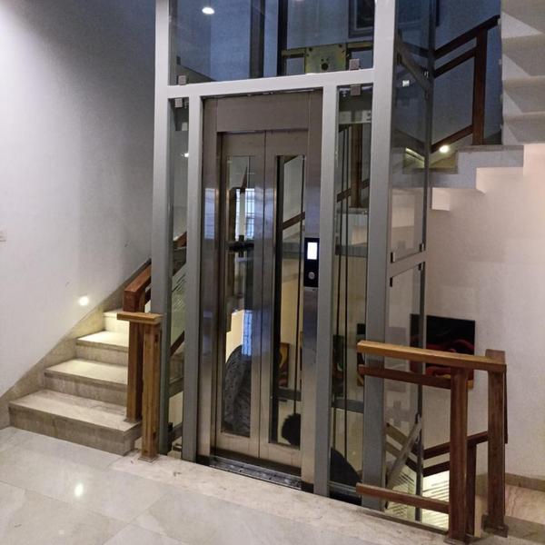 The Vini Panoramic Glass Elevator is designed to combine modern aesthetics with advanced technology, offering unmatched elegance and functionality. With 360° transparent glass panels, this elevator enhances the architectural appeal of hotels, shopping malls, office buildings, and luxury residences, providing a breathtaking view while ensuring smooth and safe rides.Key Features: - 360° Panoramic Glass Cabin – Provides a stunning view with full transparency - Premium Aesthetic Design – Enhances the ambiance of any commercial or residential space - Smooth & Silent Operation – Gearless traction technology for a vibration-free ride - Energy-Efficient Drive System – Reduces power consumption while ensuring optimal performance - Customizable Interiors – Multiple options for flooring, lighting, and handrails - Advanced Safety Features – Emergency braking system, overload sensors, and earthquake-resistant technology - IoT-Based Monitoring – Real-time tracking for predictive maintenance and remote diagnostics The Panoramic Glass Elevator by Vini Elevators is a perfect blend of luxury, functionality, and cutting-edge technology, making it a statement piece for any modern architectural structure.