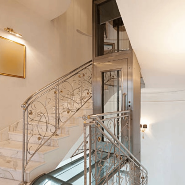 The Luxury Home Elevator by Vini Elevators is an elegant and efficient mobility solution for modern residences. Designed with a sleek and stylish appearance, this lift enhances the aesthetic appeal of homes while providing easy access to multiple floors. With smooth and noiseless operation, advanced safety features, and customizable interiors, this elevator is perfect for homeowners seeking comfort and convenience. Whether installed in villas, duplexes, or bungalows, the home lift adds value to the property while ensuring safe and effortless vertical movement for all family members.