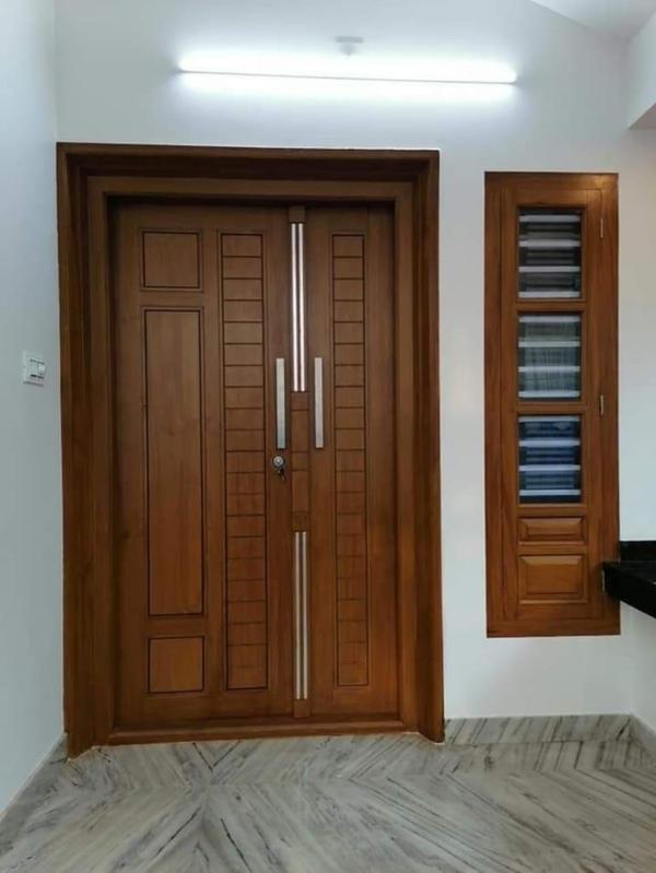 A Leading Teak Wood Interiors We Provide Affordable Cost And No Compromise in Quality In Works,Original Nilambur Teak Wood Only For All.Classic Carved Teak Wood Door 1.Design: Intricate floral, geometric, or traditional motifs hand-carved into the teak wood. 2.Finish: Natural teak polish to enhance the wood’s golden-brown hueModern Minimalist Teak Door 1.Design: Clean lines, sleek panels, and minimal carving for a contemporary look. 2.Finish: Matte or satin polish to retain the wood’s natural texture.Double Teak Wood Doors (Grand Entrance) 1.Design: Two large teak wood doors with symmetrical carvings or paneling. 2.Finish: High-gloss polish for a regal appearance.Key Considerations for Teak Wood Main Doors:✅ 1. Wood Quality: Use Grade A (Burma/Myanmar teak) for the best durability.✅ 2.Thickness: Ideal thickness is 1.75” to 2.5” for security and insulation.✅ 3. Polish Type: Natural oil polish (for raw look) or PU polish (for shine).✅ 4.Maintenance: Apply teak sealant every 2-3 years to prevent weathering.✅ 5. Budget: Full teak doors range from ₹30,000 to ₹2,00,000+ depending on design .