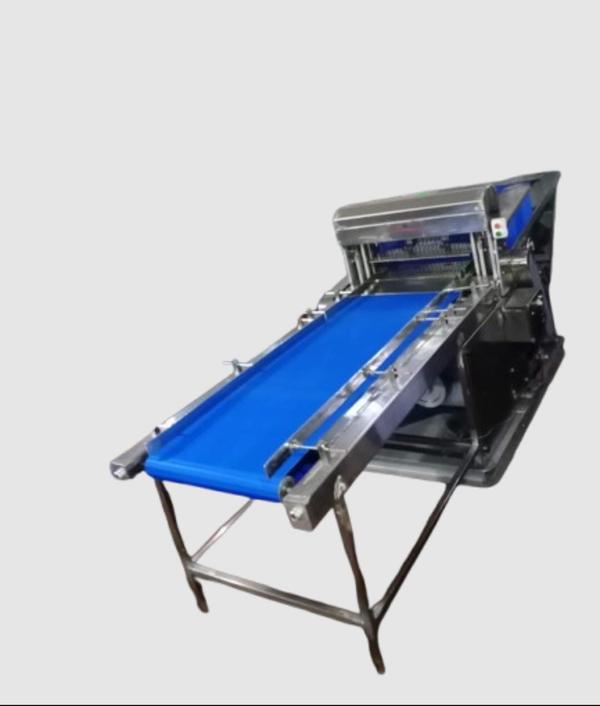 It sounds like you're interested in learning about the Real Industries High-Speed Bread Slicer with a 6-foot conveyor. I can provide an informative overview of this type of equipment.Real Industries High-Speed Bread Slicer (with 6-Foot Conveyor)Overview: Real Industries is known for manufacturing reliable and durable food processing machinery, particularly for bakery products. The High-Speed Bread Slicer is a critical piece of equipment designed to slice bread with precision and efficiency. Bread slicers are often used in large-scale bakeries, commercial kitchens, and food production facilities to ensure fast and consistent slicing of loaves.The 6-foot conveyor plays a crucial role in the bread slicing process by transporting loaves of bread into the slicer and ensuring a continuous, automated workflow.Key Features & BenefitsHigh-Speed Operation:The slicer operates at high speeds, allowing bakeries to handle large volumes of bread quickly. This is important for meeting the demands of commercial production where time efficiency and consistency are paramount.Precision Slicing:The slicer is designed to provide uniform slices of bread, ensuring consistent thickness. Whether for sandwich loaves, artisan breads, or other types, the slicer can be adjusted to accommodate various slice thicknesses.6-Foot Conveyor:The integrated conveyor system ensures smooth transport of loaves from one end to the other. The 6-foot length is especially beneficial for larger-scale operations, allowing multiple loaves to be sliced in quick succession.The conveyor belt is usually made of food-grade material and is easy to clean and maintain.Adjustable Settings:Many high-speed bread slicers offer adjustable settings for slice thickness, ensuring flexibility to meet the specific needs of different bakery products.Durability:Real Industries' equipment is typically constructed from stainless steel and other durable materials to withstand the rigors of constant use. This makes it resistant to rust and corrosion, ideal for high-moisture environments like bakeries.Safety Features:The slicer will have safety features to protect workers during operation, such as safety guards, emergency shut-offs, and other protective measures.Easy Maintenance:The design of the slicer and conveyor system is made with easy maintenance in mind. Many models come with easy-to-remove parts, making cleaning and service efficient and hassle-free.Energy-Efficient:Real Industries typically designs their machines to be energy-efficient, reducing operating costs over time while maintaining high productivity levels.ApplicationsCommercial Bakeries: Used to slice bread in bulk for sandwich loaves, bread packs, and other bakery products.Industrial Food Production: Can be part of an automated food production line where bread slicing is one step in a larger process.Supermarkets & Wholesale Distributors: Supermarkets can use these slicers to prepare fresh bread for customers, offering pre-sliced loaves in various thicknesses.SpecificationsSpeed: Capable of slicing hundreds to thousands of loaves per hour, depending on the model.Conveyor Length: The 6-foot conveyor helps facilitate a continuous flow of bread into the slicer.Power Requirements: Typically requires standard industrial power (depending on the model, this could be 240V, 3-phase, etc.).Slice Thickness Adjustment: Adjustable range to allow different slice thicknesses, typically in the range of 1/16 inch to 1 inch.Dimensions: While size can vary, this equipment is designed for industrial use and often occupies significant floor space. A 6-foot conveyor adds additional length to the overall system.Considerations Before PurchaseSpace Requirements:Given the size of the slicer and the 6-foot conveyor, it’s important to ensure your facility has sufficient space to accommodate the equipment without disrupting workflow.Maintenance:Consider the ease of maintenance and availability of replacement parts. Real Industries typically has a good reputation for customer service, but it’s always a good idea to ask about maintenance schedules, servicing, and parts availability.Customization Options:Depending on the bread types you produce, you might want to inquire about customization options for different bread sizes, slice thickness, or additional features like packaging integration.Power Supply:Check whether your facility’s electrical infrastructure is compatible with the power requirements of the slicer, as industrial machines can sometimes require specialized power sources.Budget:High-speed bread slicers can be a significant investment, so it’s important to consider both upfront costs and long-term operating expenses. However, the increase in productivity and consistency can justify the expense over time.Would you like to know more details, such as specific models or pricing? Or perhaps information on installation or maintenance? Feel free to ask!