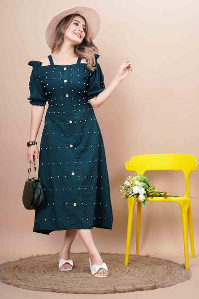 This beautiful Rama Moti Kurti, designed By PALSANA Brothers PVT. LTD. to bring out your inner grace. Crafted from high-quality fabric, this kurti features intricate moti (pearl) embellishments that add a touch of sophistication and sparkle. The soothing green hue enhances its traditional charm, making it a versatile piece perfect for festive gatherings, casual outings, or even semi-formal events. Pair it with leggings, palazzos, or jeans for a complete ethnic chic look.Located near Sitanagar Chowk, Punagam, we provide high-quality women's apparel that reflects the latest fashion trends. Visit us for the best women’s kurtis in Surat and elevate your wardrobe with unique and elegant designs.Color: Rich RamaEmbellishment: Handworked moti (pearls)Fabric: Comfortable and breathable Style: A-lineNeckline: Off ShoulderSleeve: Half SleeveOccasion: Festive, Casual, Office Wear