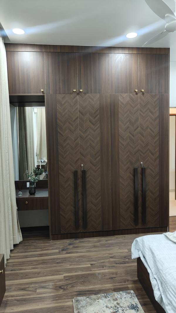 A wardrobe is an essential piece of furniture designed for storing clothes, accessories, and other personal items in an organized and accessible manner. Typically constructed from wood, metal, or engineered materials, wardrobes come in a variety of styles, sizes, and finishes to suit different interior aesthetics and storage needs. A standard wardrobe often includes a combination of hanging space for garments like shirts, dresses, and coats, as well as shelves and drawers for folded clothes, shoes, and accessories.
Some modern wardrobes also feature sliding doors, mirrors, built-in lighting, or modular compartments, adding both functionality and a contemporary touch to the room. Depending on the layout, wardrobes can be free-standing, wall-mounted, or built-in to maximize space in bedrooms, dressing rooms, or walk-in closets.
A well-designed wardrobe helps maintain a clutter-free environment while keeping clothing easily accessible and in good condition. It can reflect personal style, whether minimalist, classic, or luxurious. Beyond its practicality, a wardrobe plays a vital role in interior design, contributing to the overall ambiance and organization of a living space. Whether compact or expansive, the right wardrobe enhances both the aesthetics and functionality of any home.