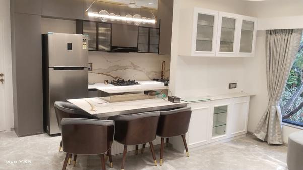 A modular kitchen is a modern type of kitchen made using ready-made cabinets or parts, called modules. These parts can be arranged in different ways to fit the size and shape of your kitchen. Modular kitchens are designed to be neat, organized, and easy to use, making them a great choice for all types of homes.The kitchen usually includes lower cabinets, wall cabinets, drawers, countertops, and special storage options like pull-out trays, corner units, and bottle holders. You can also add built-in appliances like ovens or dishwashers. These kitchens are made using strong materials like plywood or MDF, and the outer finish can be laminate, acrylic, glass, or other smooth materials that look stylish and are easy to clean.Modular kitchens come in different layouts like L-shape, U-shape, straight, parallel, or even with an island, depending on the space available. One big advantage is that they are easy to install, repair, or change. If one part gets damaged, you can replace just that part without affecting the whole kitchen. Overall, modular kitchens are a smart, modern, and flexible way to create a kitchen that looks good and works well for everyday use.