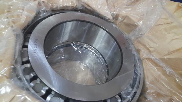 The 352226 NXV bearing is a high-performance double-row tapered roller bearing designed for demanding industrial applications where both radial and axial load capacities are essential. With an inner diameter of 130 mm, outer diameter of 230 mm, and a width ranging from 145 mm to 149.25 mm, it offers a robust structure that ensures stability and durability under heavy load conditions.Manufactured from premium chrome steel (typically 52100 alloy), the 352226 bearing delivers exceptional hardness, wear resistance, and fatigue life, making it ideal for long-term use in harsh working environments. The double-row tapered design allows for accurate load distribution across the rollers, minimizing stress and increasing operational reliability.Key features include:High dynamic and static load ratings, enabling it to withstand both impact and sustained loads.Tapered roller geometry, which reduces friction and improves alignment under combined loads.Precision-grade tolerances (often available in P0, P5, or P6), ensuring smooth rotational movement and minimal vibration.High-temperature resistance, allowing consistent performance even under heat-generating applications.This bearing is commonly used in:Heavy machinery and construction equipmentRailroad axle systemsIndustrial gearboxes and reducersRolling mills and large mechanical assembliesOverall, the 352226 NXV bearing is engineered for high reliability, extended service life, and superior load handling, making it a critical component in many high-stress industrial systems.