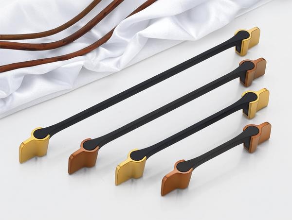 A collection of contemporary handles, identified as DP-CH-007 Cabinet & Wardrobe Handles, showcases a striking bi-color design, perfectly suited for modern wardrobes or doors. Each handle features a slender, matte black central bar, providing a comfortable grip and a touch of understated elegance. The ends of each handle flare out into bold, angular accents, available in contrasting metallic finishes such as a warm brass, a rich bronze, and potentially a durable PVD-coated gold or silver for enhanced resilience and a touch of luxury.These handles are meticulously crafted, emphasizing both visual appeal and enduring quality. Constructed from high-grade, corrosion-resistant materials, they are engineered to withstand the demands of daily use without succumbing to wear or environmental damage, ensuring their sophisticated appearance is maintained for years to come. The sleek design, characterized by the clean lines of the matte black bar and the sharp angles of the metallic ends, offers a distinctly modern aesthetic that enhances the overall look of the furniture or doors they adorn.While these are primarily designed as handles for wardrobes and doors, their premium construction and the potential use of a PVD finish suggest a level of quality often found in high-end hardware. The PVD coating, known for its exceptional hardness and resistance to scratches, fading, and corrosion, would make these handles a practical and stylish choice for a variety of interior settings