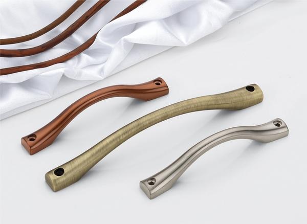 This window handle presents a study in  design and diverse metallic expressions, purpose-built to enhance contemporary windows.. Each handle showcases a smoothly contoured, elongated bar, providing a comfortable grip, seamlessly conjoining to subtly flared mounting bases at either terminus. The available palettes encompass a spectrum of modern aesthetics, featuring a warm, antique brass, a sleek, brushed nickel or silver, and a muted, aged bronze, evoking a sense of timeless sophistication. These premium handles are also corrosion resistant, making them ideal for window applications.The design narrative of these handles centers around a harmonious balance of form and texture. The gently curved central bar introduces a tactile and visual softness, while the subtly flared bases provide a stable and contemporary anchor. This deliberate fusion of smooth curves and defined edges ensures that these handles seamlessly integrate with a wide array of window designs, including windows, from farmhouse to modern industrial settings.Forged from high-caliber, corrosion-resistant alloys, these handles are engineered to endure the demands of everyday interaction and exposure to the elements when used on windows, without succumbing to wear or environmental degradation, ensuring their refined appearance persists over time. The brushed nickel/silver renditions offer a contemporary and understated elegance, while the aged bronze introduces a sense of rustic sophistication, and the antique brass imparts a touch of vintage warmth. These premium handles offer a sleek design suitable for various window applications.