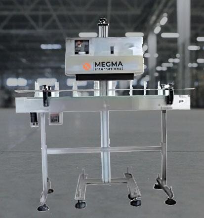 An Automatic Induction Sealing Machine of Megma International is an advanced packaging system designed to hermetically seal bottles and containers using electromagnetic induction technology. This machine is widely used in pharmaceutical, food & beverage, cosmetics, and chemical industries to ensure product safety, prevent leakage, and extend shelf life.The conveyor system moves sealed containers with caps lined with induction foil to start the process.  The foil liner inside the cap is activated by an electromagnetic field that produces heat when it passes under the induction sealing head.  Without direct touch, the heat creates a strong bond between the liner and the bottle's mouth, resulting in an airtight and impenetrable seal.  Because it is PLC-controlled, the system can precisely vary the sealing time and power, making it compatible with a range of cap sizes, container types, and production speeds. With its high-speed operation, no-contact sealing, and minimal maintenance, the Automatic Induction Sealing Machine is an essential solution for leak-proof and tamper-evident packaging in high-production environments. 