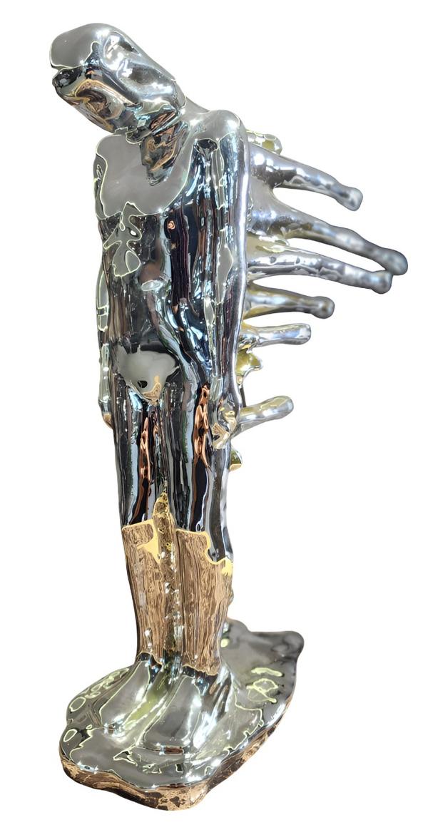 DESCRIPTION - Human body ornament water drop. MATERIAL         -  Resin Dimensio          - 32*10*35COLOU              -  Silver                                                           