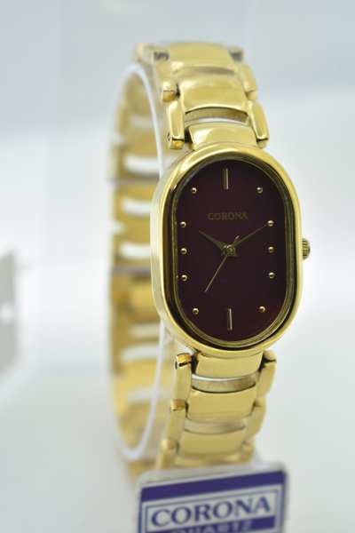 Presenting our Gold Plated Women's Wrist Watch, a radiant blend of elegance and precision. The luxurious gold-plated case embraces a captivating design, accentuated by a delicate red dial. Elevate your sophistication with this exquisite timepiece, where opulence and grace come together in a stunning expression of femininity.