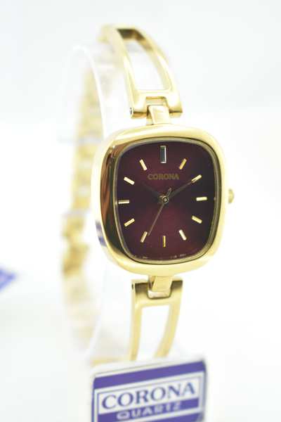 Introducing our Gold Plated Women's Wrist Watch, a masterpiece that marries luxury with precision. The radiant gold-plated case envelops a captivating maroon dial, powered by Japanese movement for impeccable accuracy. Elevate your elegance with this exquisite timepiece, where opulence and reliability converge in a stunning expression of femininity.