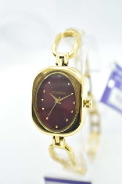 Introducing our Gold Plated Women's Wrist Watch, a masterpiece that marries luxury with precision. The radiant gold-plated case envelops a captivating maroon dial, powered by Japanese movement for impeccable accuracy. Elevate your elegance with this exquisite timepiece, where opulence and reliability converge in a stunning expression of femininity.
