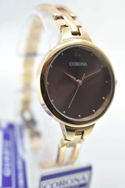 This watch is an ideal accessory for women of all ages. The dial features a gold tone with brownish colored markers and hands. This watch is perfect for those who love fashion and style.