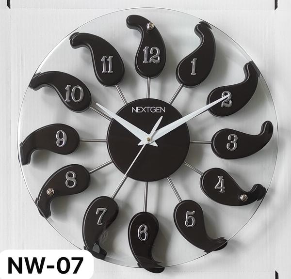 Introducing the stylish WOODEN/GLASS CLOCK NW-04 for your home or office. This clock features a classic brown dial enclosed in a wooden frame, perfect for a contemporary theme. The clock mechanism is quartz for accurate timekeeping. Made of high-quality wood, this clock is durable and long-lasting. Add this unique piece to your collection today!