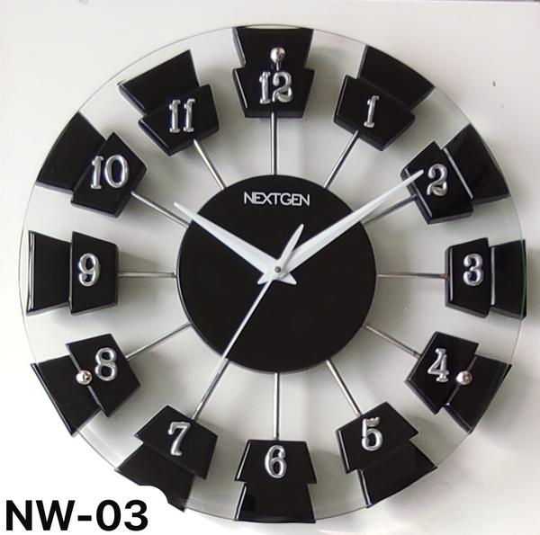 WOODEN/GLASS CLOCK NW-03 is a stylish contemporary clock designed for your home or office. The black dial stands out against the wooden frame, adding a touch of elegance to any room. Made from high-quality wood, this clock features a reliable quartz mechanism for accurate timekeeping. Add this timeless piece to your decor today. (Net Quantity: 1)