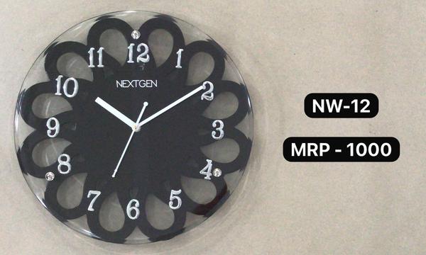 Introducing the stylish WOODEN/GLASS CLOCK NW-04 for your home or office. This clock features a classic brown dial enclosed in a wooden frame, perfect for a contemporary theme. The clock mechanism is quartz for accurate timekeeping. Made of high-quality wood, this clock is durable and long-lasting. Add this unique piece to your collection today!