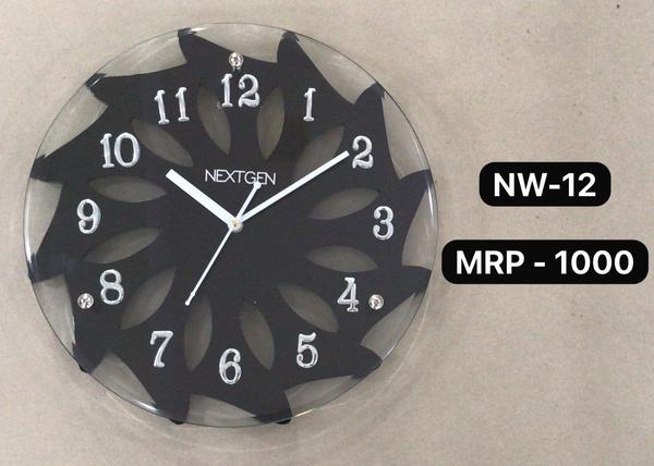 Introducing the stylish WOODEN/GLASS CLOCK NW-12 for your home or office. This clock features a classic brown dial enclosed in a wooden frame, perfect for a contemporary theme. The clock mechanism is quartz for accurate timekeeping. Made of high-quality wood, this clock is durable and long-lasting. Add this unique piece to your collection today!