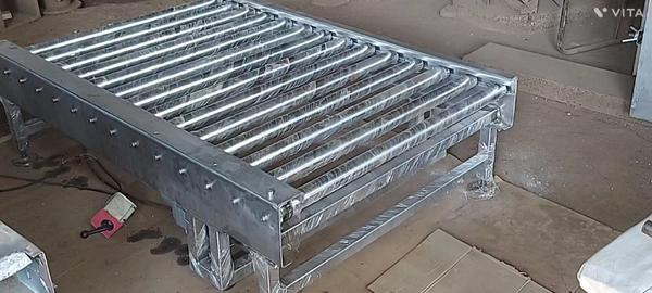 Roller Conveyor is a type of material handling system that uses rollers cylindrical components that rotate to transport items from one location to another. These conveyors are commonly used in warehouses, distribution centers, manufacturing, and packaging lines for moving boxes, pallets, or other stable, rigid items.