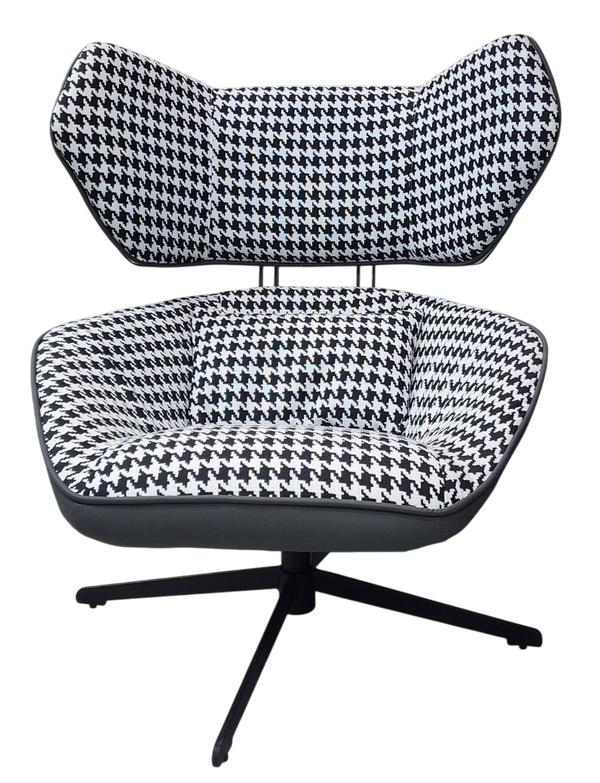 This modern leisure chair features a striking black and white houndstooth fabric with PU accents and high-density foam for comfort. Supported by a sturdy metal swivel base, it offers both style and functionality for any contemporary space.TYPE - leisure chairMATERIAL - fabric+PU+High quality foam+metal legCOLOUR - white & black