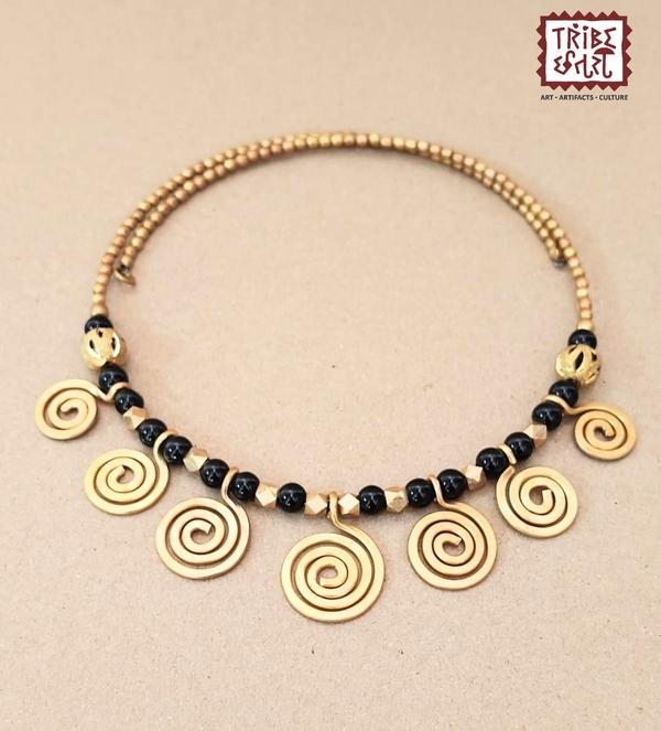 Dhokra Necklace setDhokra is an art almost 4000 years old, it adds an ethnic value to your space.It is also a long lasting & low maintenance item. The origin of dhokra art is from the tribal belts of West Bengal, Chhattisgarh and Odisha. Thus, the eccentric patterns, motifs and designs always stand out. When one adorns the dhokra tribal jewelry, they come across colorful beads, soft threads and metallic pendants that highlight the beauty of the attire. The larger pendants with simple threads are a hallmark of dhokra jewelry. The ornaments are inspired by elements of nature like leaves, the sun, the moon, spirals, etc. The beauty of these jewellery pieces lies in their versatility to be paired with either Indian clothing as well as western clothing to add that bohemian stroke.Tribe Chatari in Pune offers an authentic collection of Dhokra tribal jewellery, showcasing the rich heritage of Indian tribal artistry. Dhokra, a traditional form of metal casting, is known for its intricate designs and is a significant part of India's tribal art legacy.🛍️ Explore Dhokra Jewellery at Tribe ChatariLocated in the heart of Pune, Tribe Chatari is a hub for tribal artifacts and handicrafts from across India. The store features a diverse range of products, including Dhokra jewellery & bamboo jewellery which is handcrafted by skilled artisans. Visitors have praised the store for its extensive collection and the owners' deep knowledge of tribal arts.