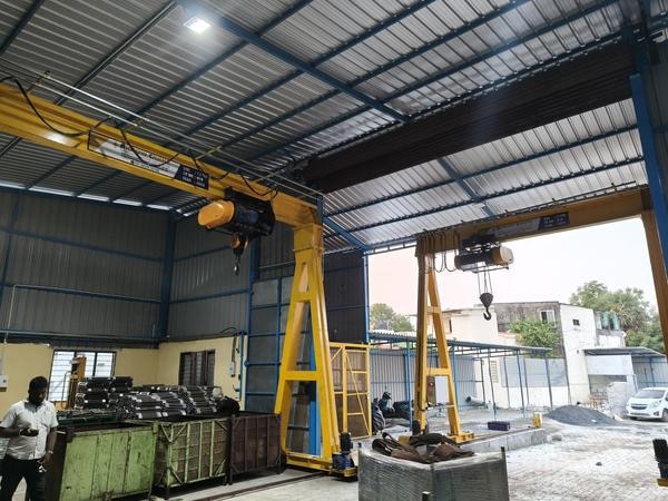 Where Single Girder Gantry / Goliath Crane used?Industrial areas where the heavy load products are manufactured, in which this cranes are used in lifting the parts of the products manufacturedService and MaintenanceAll the parts accessories for our hoists and cranes are manufactured by Arrowcranemhe’s CranesWe provide dedicated support 24*7 for all the equipment’s that we supply.We take up annual maintenance contracts (AMC) for your assistance.Contact Now +91 8825924198.Single Girder Gantry Crane / Goliath CraneArrowcranemhe’s Cranes is one of the top Gantry Crane / Goliath crane manufacturers in Chennai, India. We design , fabricate and installs gantry bridge crane systems to meet your material handling requirements. Our gantry bridge crane systems are available with either single, double girder bridges.They are ideally used in aircraft, automotive, construction and marine repair shops where shifting and moving of building blocks are required. They also work well in warehouses, machine shops, and loading areas. Gantry-cranes are supplied with four roller-bearing steel wheels for easy maneuverability. These cranes are highly efficient to work outdoors, achieving high speeds and capacities.The Single Girder Gantry / Goliath Crane can be operated with cable connected pendant or radio remote control based on customer requirement. The operational modes of the gantry crane / goliath crane has different modes listedFully Automated ModeSemi Automated ModeManual Modein which all the three modes are delivered to customers based on their requirements.Most of the gantry cranes / goliath cranes are placed at outdoors however they can be installed into a closed building. The cranes placed outdoor are protected with corrosion allowance in design of main load bearing structural members, drilled holes on walkway to avoid accumulation of rain water, localized full cover for trolley, covers for Long travel motor/ brake, additional parking brake for Long travel motion, special paint, etc.Arrowcranemhe’s GANTRY CRANES / GOLIATH CRANES ARE UNRIVALED IN DESIGN STRENGTH, STABILITY, AND QUALITY CONSTRUCTION:Precision tolerances and welding ensure component alignment and operational stability.We use standardized, quality Indian I-beams.All nuts, bolts, and pins are plated for corrosion resistance, and all Gantries are painted safety yellow.Outdoor use options available, including exterior coatings and stainless steel motors.Single Girder Gantry Goliath Crane from Arrow Crane offers significant advantages such as reduced installation costs due to its simple setup, lower maintenance requirements.Contact Now +91 8825924198.