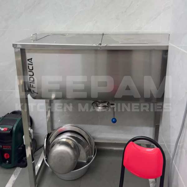 An Idli Batter Mixer Machine is a high-performance appliance designed to grind soaked rice and urad dal into a smooth and consistent batter, essential for making soft and fluffy idlis. It is typically used in commercial food preparation environments due to its efficiency, capacity, and durability.Key Features:High-Speed Grinding Motor:Powerful motor (ranging from 1HP to 5HP or more depending on size)Operates at high RPM for quick and smooth grindingStainless Steel Construction:Food-grade stainless steel body and drumCorrosion-resistant and easy to cleanTilting or Non-Tilting Drum:Tilting models allow easy unloading of batterNon-tilting versions are generally more compactCapacity Options:Available in various capacities: 5L, 10L, 20L, 40L, or higherSuitable for small-scale to industrial-scale operationsEfficient Grinding Stones or Blades:Heavy-duty grinding stones for traditional textureSome models use sharp stainless steel blades for faster processingCooling System (in commercial models):Prevents motor overheating during extended useControl Panel:On/Off switches, overload protection, and sometimes a timer functionAdvantages:Produces smooth, aerated batter ideal for idlis and dosasSaves time and labor compared to manual grindingConsistent quality and texture of batterDesigned for continuous use in commercial environmentsApplications:Hotels and RestaurantsCatering ServicesIdli-Dosa Batter ManufacturersCommunity KitchensHome Use (smaller models)