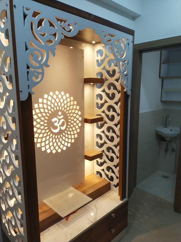 Temple Design by Brajeshwari InteriorsAt Brajeshwari Interiors, we believe your home temple is more than just a place of prayer – it is the spiritual heart of your home. Our custom temple design services in Gurugram blend tradition with modern aesthetics to create sacred spaces that radiate peace, devotion, and positive energy.✨ Why Choose Brajeshwari Interiors for Temple Design?✅ Vastu-Compliant Designs – We incorporate Vastu principles to enhance spiritual harmony.✅ Traditional & Contemporary Styles – Whether you want a carved wooden mandir or a sleek marble temple, we create designs that reflect your faith and lifestyle.✅ Customized for Every Home – From compact flats to spacious villas, we design mandirs to fit your space beautifully.✅ Premium Materials – Choose from teak wood, marble, MDF with CNC work, brass accents, LED lighting, and more.✅ Expert Craftsmanship – Each temple is crafted with precision, devotion, and a keen eye for detail.🪔 Our Temple Design Services Include ---Home Temple InstallationWall-Mounted Pooja UnitsFloor Mandir DesignsCNC Jaali Mandir PanelsBacklit and LED-Lit Pooja UnitsTemple Room Interior DesignTraditional Wooden Mandir CarvingsMarble Temple with Bells and DomesFoldable Pooja Unit for Compact Homes📍 Temple Design in Gurugram & NCRWe proudly serve clients across Gurugram, Delhi NCR, and surrounding regions, bringing spiritual elegance into every home with personalized temple designs.💬 Let’s Design Your Divine SpaceLooking for a custom temple design in Gurugram? Whether it’s a corner unit or a full-fledged pooja room, Brajeshwari Interiors is here to turn your vision into reality.📞 Call us today  9990554473 📩 Book a consultation online to discuss your dream temple.         brajeshwariinteriors@gmail.com