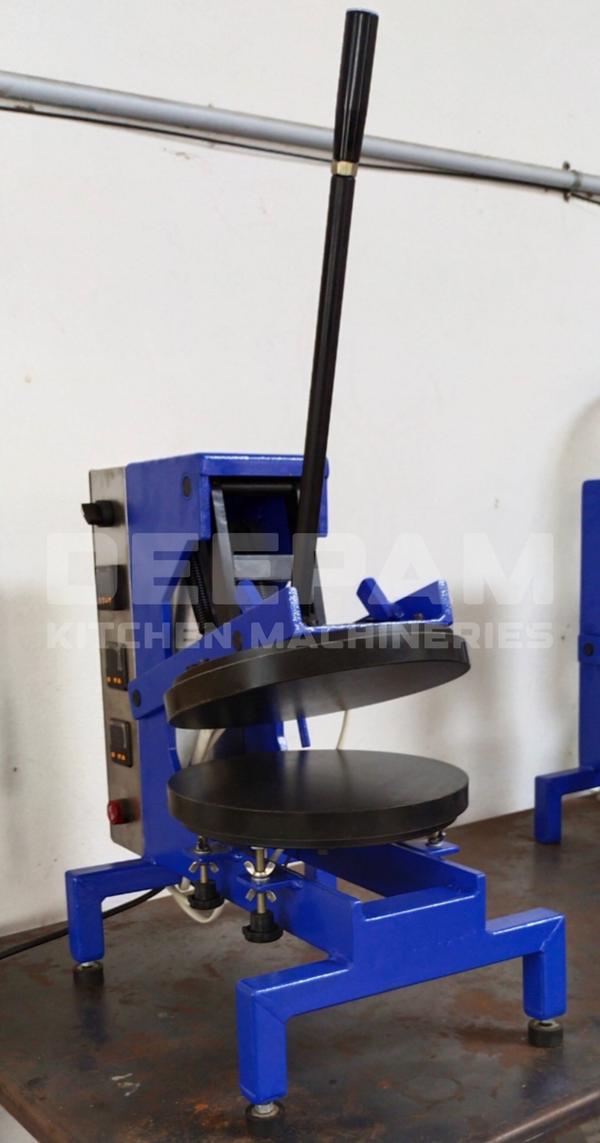 Fiducia Chapathi Pressing Machine – Manual Model  Streamline your chapati-making process with the Fiducia Chapathi Pressing Machine by Deepam Kitchen. Designed for high efficiency and consistent quality, this manual model is an essential addition to any commercial kitchen.  Key Features:  Dual Heating Plates:    Equipped with top and bottom plates, each powered by a 1000W heating element. The plates are Teflon-coated, ensuring non-stick performance and easy maintenance.  Precise Controls:    Each heating plate features an independent *temperature controller, giving you full control to achieve the perfect cooking temperature. A built-in **timer for pressing* ensures uniform cooking and ease of operation.  Optimal Dimensions:    - Plate Diameter: *280 mm*    - Chapathi Diameter: *9.5 inches*    - Adjustable Thickness: *1 mm to 6 mm*, offering versatility for different preferences.  Robust Construction:    The body is constructed from *mild steel (MS)* and finished with a durable *powder-coated* layer, ensuring longevity and resistance to wear and tear.  High Production Capacity:    Achieve an impressive output of *500 to 750 chapathis per hour*, making it perfect for restaurants, catering businesses, and large-scale kitchens.  The Fiducia Chapathi Pressing Machine combines efficiency, precision, and durability, delivering consistent results with minimal effort. Whether you’re running a commercial operation or looking to streamline your chapathi production, this machine is your trusted partner for success.Dimension : 21“ X 13” X 22