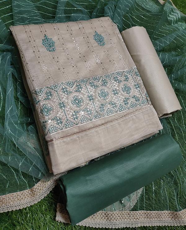 Grace in Every Thread – White & Green Elegance Unstitched DressmaterialStep into effortless charm with the White & Firozi Elegance Dress Material, a perfect blend of cool tones and refined embroidery. Designed for women who appreciate tradition with a touch of modern sophistication, this unstitched ensemble is ideal for festive wear, ethnic gatherings, or daytime elegance.✨ Top FabricColor: Pristine WhiteFabric: Soft Cotton / Chanderi (based on variant)Embroidery: Intricate Firozi (turquoise) thread work on the front, sleeves, and hem – detailed yet delicate✨ Bottom FabricColor: Contrasting FiroziFabric: Comfortable Cotton / SantoonStyle: Plain or lightly embroidered to complement the top without overpowering it✨ DupattaColor: Firozi with white accentsFabric: Chiffon / Nazneen / NetWork: Embroidered border or lace detailing for a soft, elegant finish