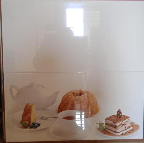 Kitchen tiles are flat, often square, pieces used to cover walls and floors, offering both functional and aesthetic benefits. They are typically made of materials like ceramic, porcelain, glass, or natural stone, and are chosen for their durability