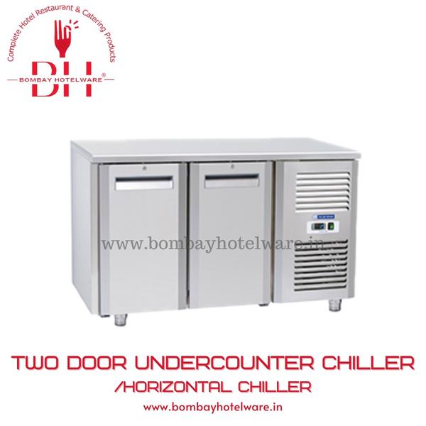 The Stainless Steel Two Door Undercounter Chiller is an essential refrigeration solution for commercial kitchens, restaurants, cafes, hotels, and catering businesses. Built with high-quality food-grade stainless steel, it combines durability and hygiene with a sleek finish.Key features:- Dual stainless steel doors with recessed handles- Energy-efficient compressor with low noise- Adjustable shelves for customized storage- Easy to clean interior and exterior- Suitable for ambient Indian temperatures Whether you're looking to upgrade your commercial refrigeration or maximize kitchen space, this undercounter chiller is a professional’s choice for reliability and performance.