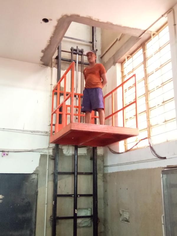 Best Rated Goods Lift Manufacturers in Manjeri, Kerala, South India.Shree Handling Equipments Goods Lift, also known as a freight elevator, is a specially designed lifting device used for transporting heavy or bulky goods vertically between floors in industrial, commercial, and warehouse settings. Unlike passenger elevators, goods lifts prioritize load capacity and durability over comfort and speed.Types of Goods LiftsHydraulic Goods LiftUses hydraulic fluid pressure to lift the platform.Suitable for medium-rise buildings.Energy-efficient as it consumes power only during lifting.Electric (Traction) Goods LiftOperated using electric motors and steel cables.Ideal for high-rise buildings and continuous operation.Scissor Lift TableA platform supported by scissor-like metal supports.Ideal for ground-to-truck or dock-level loading.Key FeaturesHigh Load Capacity (typically from 500 kg to 5,000 kg or more)Robust Construction (heavy-duty steel frame and reinforced platforms)Multiple Safety Features like:Emergency stop buttonDoor interlocksOverload protectionSafety brakesCustomizable Cabin Size to suit different types of goodsEase of Operation via push-button or remote controlEnclosed or Open Type depending on usage and safety needsApplicationsFactories & Industries – To move raw materials or finished products.Warehouses & Distribution Centers – For storage and logistics support.Supermarkets & Retail Stores – Stock transfer between floors.Construction Sites – Transport of construction materials.Hotels & Commercial Kitchens – Used as dumbwaiters for food or linen.BenefitsIncreased Efficiency in material handlingReduces Manual Labor, improving worker safetyTime-Saving solution for vertical goods transportSpace-Efficient, especially for buildings with limited layout optionsCost-Effective in the long run due to enhanced productivityWould you like a tailored description for a specific brand, capacity, or application (like warehouse, hotel, or construction site)?We are happy to supply other cities like Kozhikode, Kochi, Kollam, Thrissur, Kannur, Alappuzha, Kottayam, Palakkad, Manjeri, Thalassery, Thrippunithura, Ponnani, Vatakara, Kanhangad, Payyanur, Koyilandy, Parappanangadi, Kalamassery, Kodungallur, Neyyattinkara, Tanur, Kayamkulam, Malappuram in Kerala, South India.Other SearchesTop Goods Lift Manufacturers in ManjeriIndustrial Goods Lift Manufacturers in ManjeriSmall Goods Lift Manufacturers in ManjeriGoods Lift Manufacturers in Manjeri Contact NumberHydraulic Goods Lift Manufacturers in ManjeriBest Goods Lift Manufacturers in ManjeriElevator Manufacturers in Manjeri