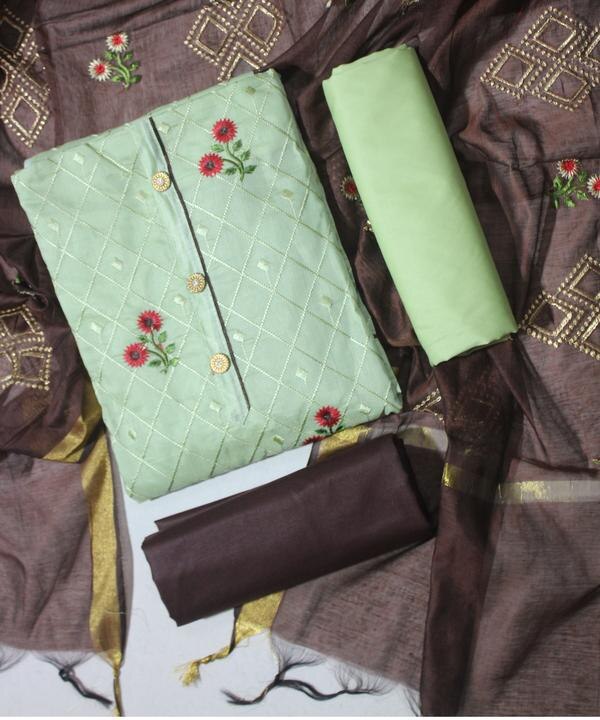 Elevate your ethnic wardrobe with this elegant Green and Brown Color Embroidered Work Dress Material. This unstitched set is designed to offer both tradition and trend, making it perfect for festive occasions, casual gatherings, or traditional celebrations.Top Fabric:Color: Rich Olive GreenMaterial: Premium Cotton / Chanderi / Georgette (choose based on actual material)Work: Intricate Embroidered Floral and Traditional Motifs in Contrasting Brown ThreadworkNeck Design: Embroidered neckline for a regal touchLength: 2.5 meters (approx.)Bottom Fabric:Color: Deep BrownMaterial: Soft Cotton / Santoon / Silk blendType: Solid fabric, complements the embroidered topLength: 2.25 meters (approx.)Dupatta:Color: Coordinated Green and BrownMaterial: Lightweight Net / Nazneen / ChiffonWork: Subtle embroidery or printed border to enhance the overall lookLength: 2.25 meters (approx.)Highlights:Soft, breathable material for all-day comfortEye-catching embroidery with a traditional flairIdeal for stitching into Salwar Kameez, Anarkali, or Straight Cut stylesPerfect for festive wear, cultural events, and semi-formal gatherings
