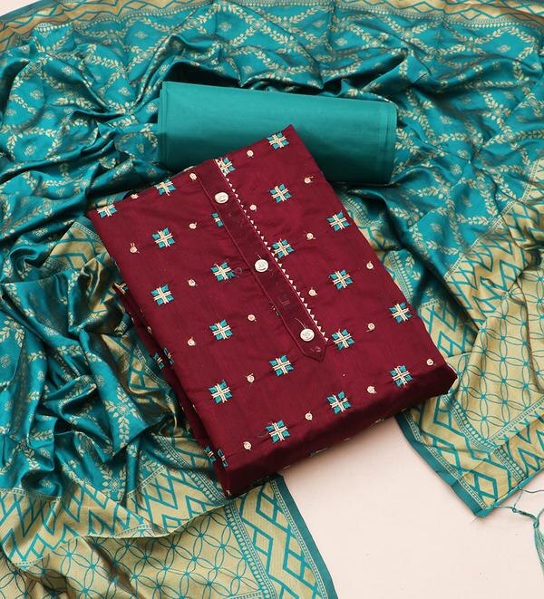 Embrace elegance and sophistication with this exquisite wine-colored unstitched dress material set. Crafted with fine embroidery and paired with a luxurious jacquard dupatta, this ensemble is perfect for festive occasions, weddings, or evening gatherings.Top Fabric: Premium fabric (cotton/silk/chanderi blend – depending on actual material), featuring intricate embroidery on the front panel for a graceful ethnic touch.Bottom Fabric: Matching plain dyed fabric, soft and comfortable, ideal for custom tailoring.Dupatta: Woven jacquard dupatta with rich patterns and a complementing border, adding a royal charm to the outfit.Color: Deep Wine – a blend of sophistication and tradition.Style: Unstitched – customizable to your preferred design (straight-cut, A-line, or Anarkali).Occasion: Suitable for festive wear, cultural functions, family gatherings, or party wear.Highlights:Elegant embroidery with fine detailingRich jacquard dupatta with woven motifsBreathable fabric and smooth finishVibrant wine shade enhances your ethnic glowTailor to perfection for a personalized fitCare Instructions:Dry clean only for best results and fabric longevity.