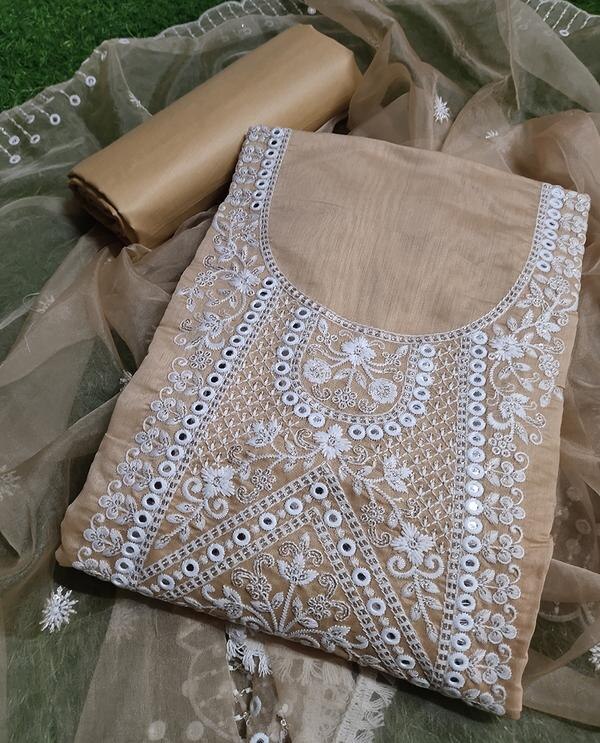 Bring timeless elegance to your ethnic wardrobe with this beautiful cream-colored unstitched dress material, adorned with intricate embroidery and paired with a graceful Chanderi dupatta. Subtle yet sophisticated, this ensemble is perfect for daytime functions, festive gatherings, and traditional celebrations.Top Fabric: Premium-quality fabric (cotton/silk/blend – based on actual material) in a soft cream shade, embellished with delicate embroidery for a refined look.Bottom Fabric: Matching plain dyed material, comfortable and easy to tailor.Dupatta: Elegant Chanderi dupatta with light zari weaving or border, offering a sheer, polished finish.Color: Soothing Cream – versatile, classy, and perfect for all occasions.Style: Unstitched – can be tailored to your preferred silhouette (straight-cut, A-line, Anarkali, etc.).Occasion: Ideal for festive wear, pujas, family events, or formal ethnic gatherings.Highlights:Subtle and sophisticated embroideryLightweight Chanderi dupatta with graceful drapePerfect for elegant, minimalistic ethnic looksComfortable, breathable fabricCustomizable tailoring to suit your styleCare Instructions:Dry clean only to maintain embroidery and Chanderi dupatta texture.