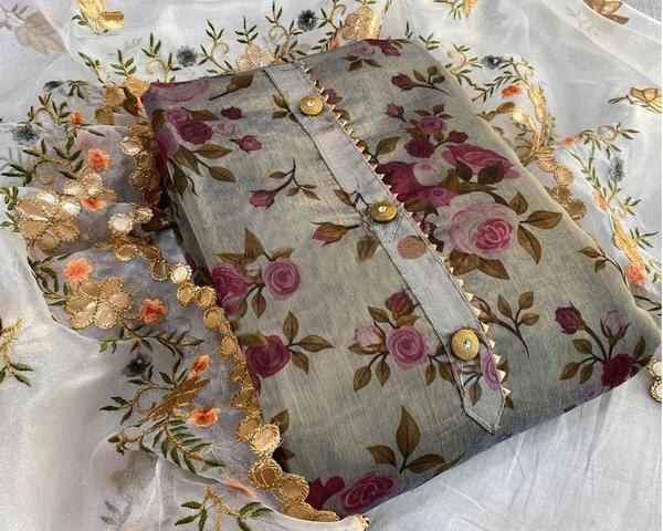 Elevate your ethnic wardrobe with this elegant Grey Digital Printed Chanderi Dress Material, a perfect blend of traditional charm and contemporary style. Crafted from lightweight and breathable Chanderi fabric, this unstitched suit set offers a rich texture and subtle sheen that adds a touch of sophistication to your look.Top Material: Premium Chanderi with intricate digital floral and abstract prints in shades of grey, silver, and soft pastels. The delicate design brings a refined yet trendy aesthetic to your attire.Bottom Material: Soft and comfortable cotton or Chanderi blend (depending on variant), designed to complement the top’s print and color palette.Dupatta: Matching Chanderi dupatta with digital print and subtle zari border or printed edge, enhancing the elegance of the overall outfit.Key Features:Fabric: Chanderi (top & dupatta), Cotton/Chanderi (bottom)Print: High-resolution digital print for lasting vibranceStyle: Unstitched – suitable for custom tailoring (salwar suit, straight kurta, or A-line)Occasion: Ideal for festive wear, office wear, casual gatherings, and semi-formal eventsCare: Dry clean or gentle hand wash recommended to preserve print and fabric textureDimensions:Top: Approx. 2.5 metersBottom: Approx. 2.5 metersDupatta: Approx. 2.25 meters