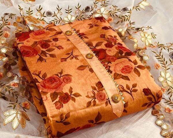 Infuse warmth and vibrance into your ethnic wardrobe with this Orange Digital Printed Chanderi Dress Material with Dupatta. The radiant hue combined with high-quality digital prints on luxurious Chanderi fabric makes this ensemble a timeless choice for festive occasions and casual elegance.Top Material: Premium Chanderi fabric in a rich orange shade, adorned with digital floral or traditional motifs that add a touch of modern artistry to a classic textile. The semi-sheer texture of Chanderi lends a graceful, airy look.Bottom Material: Soft and breathable cotton or Chanderi blend, carefully coordinated to complement the top fabric’s design and tone.Dupatta: Matching Chanderi dupatta featuring coordinated digital prints and delicate borders that enhance the ethnic appeal and complete the ensemble beautifully.Key Features:Fabric: Chanderi (Top & Dupatta), Cotton/Chanderi Blend (Bottom)Color: Vibrant Orange with Multi-color Digital PrintsPattern: Intricate digital floral or ethnic printsType: Unstitched — can be tailored into various styles such as straight-cut suits, Anarkalis, or kurta setsIdeal for: Festive occasions, family functions, casual outings, and office wearCare Instructions: Dry clean or gentle hand wash recommended to maintain color and fabric qualityFabric Length:Top: Approx. 2.5 metersBottom: Approx. 2.5 metersDupatta: Approx. 2.25 meters
